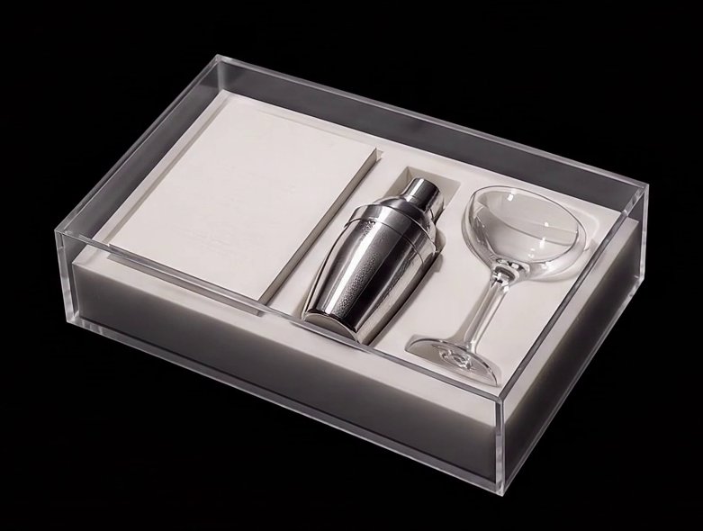 Open luxury PR box with an editorial invitation, a cocktail shaker and a coupe glass