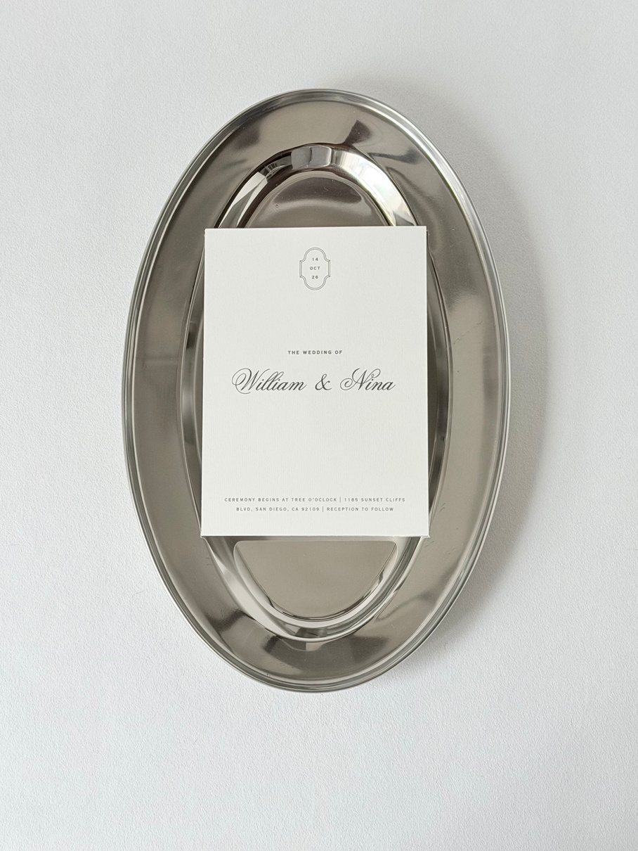 William & Nina luxury wedding invitation on an oval silver tray, editorial styling by UTWÖ Studio